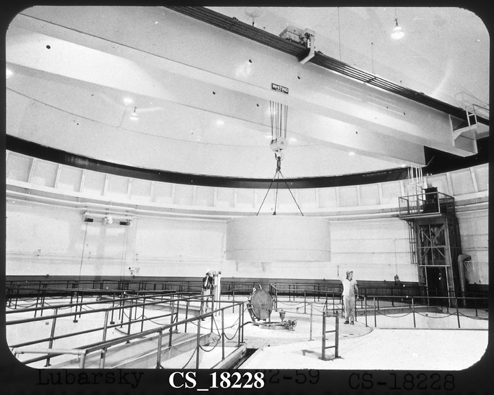 Space History Photo: Two Men on Lily Pad Guide Crane